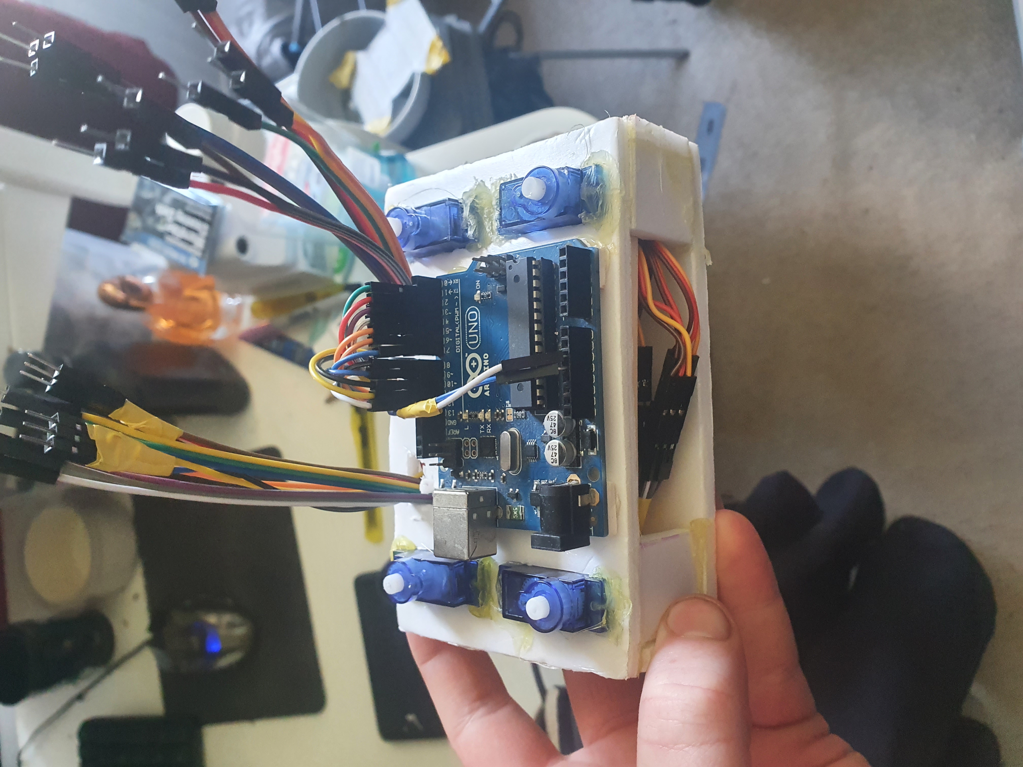 Wiring and Arduino electronics inside the miniature quadruped robot